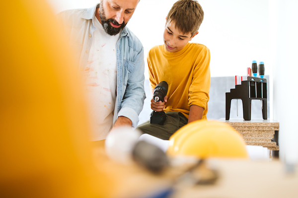 Father and son working on home renovating
