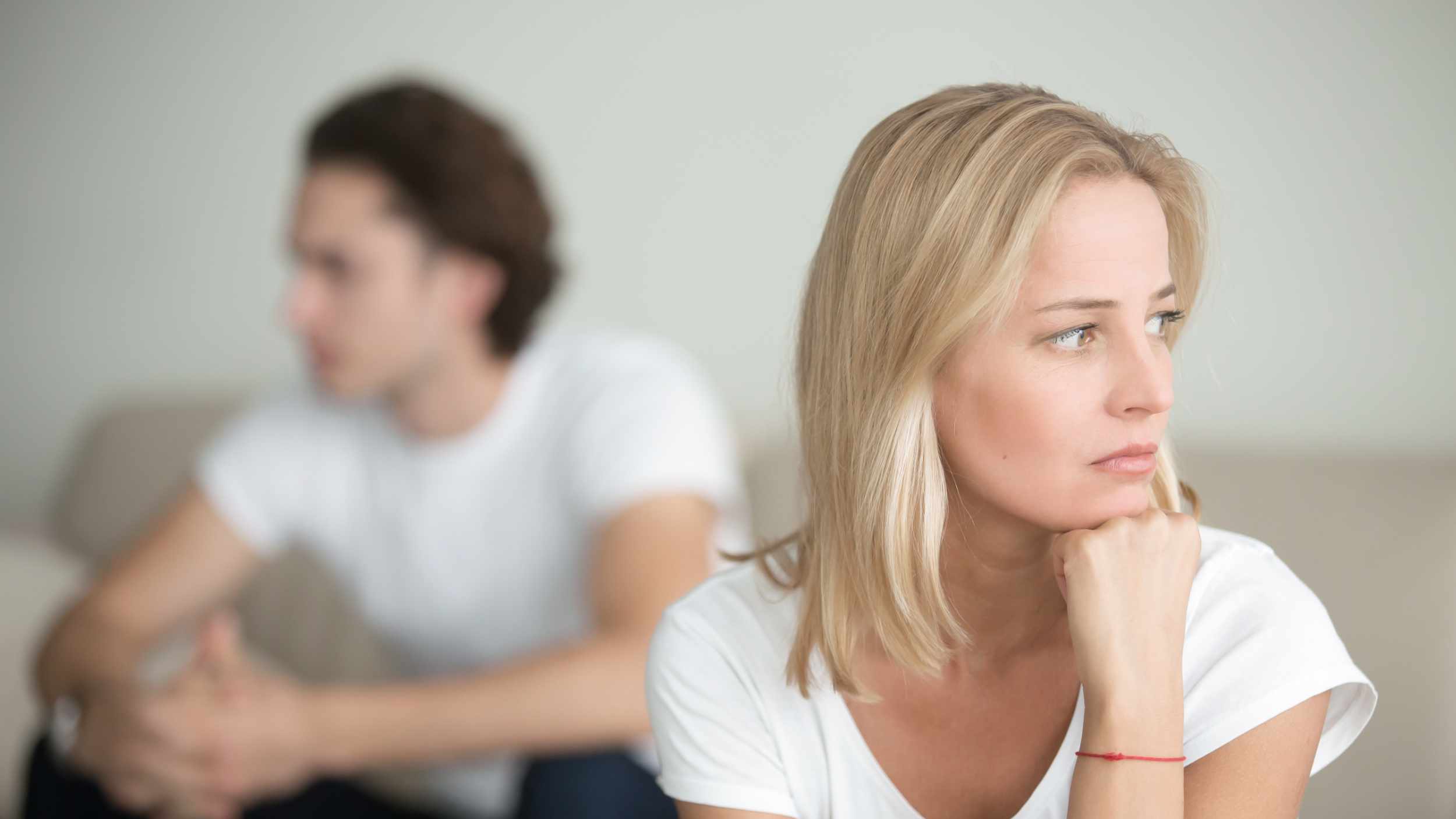 Serious sad woman thinking over a problem, man aside, meeting therapist, poor chance of getting pregnant after 40, unmet expectations, unable to handle family finances, interested in different things